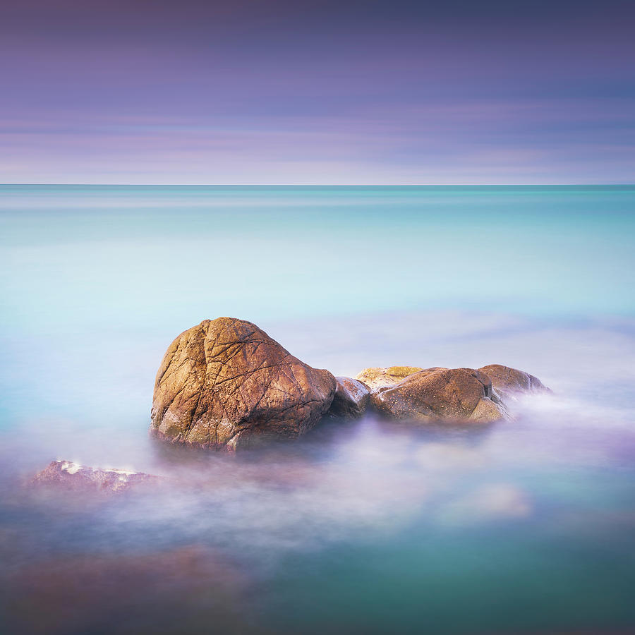 Rocks and sea in a cloudy day Photograph by Stefano Orazzini