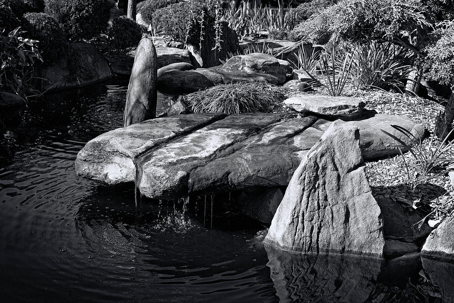 Black And White Photograph - Rocks And Water by Wayne Sherriff