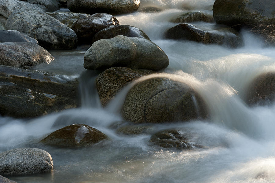 Rocks in the river Photograph by Fotosearch