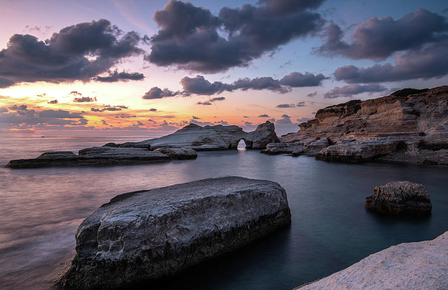 Rocky seashore seascape with dramatic and beautiful sunset at se Photograph by Michalakis Ppalis