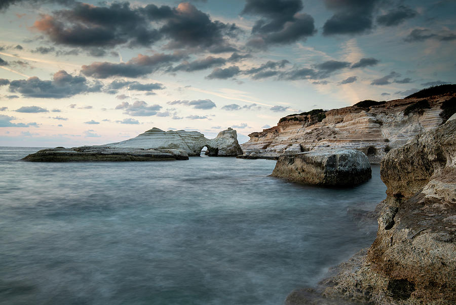 Rocky seashore seascape with wavy ocean at sea caves coastal are Photograph by Michalakis Ppalis