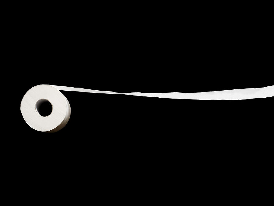 Roll Of Toilet Paper On A Black Background. Photograph by Ballyscanlon