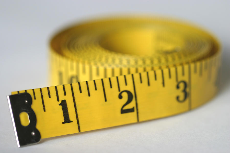 Rolled Measuring Tape Photograph by Timeless