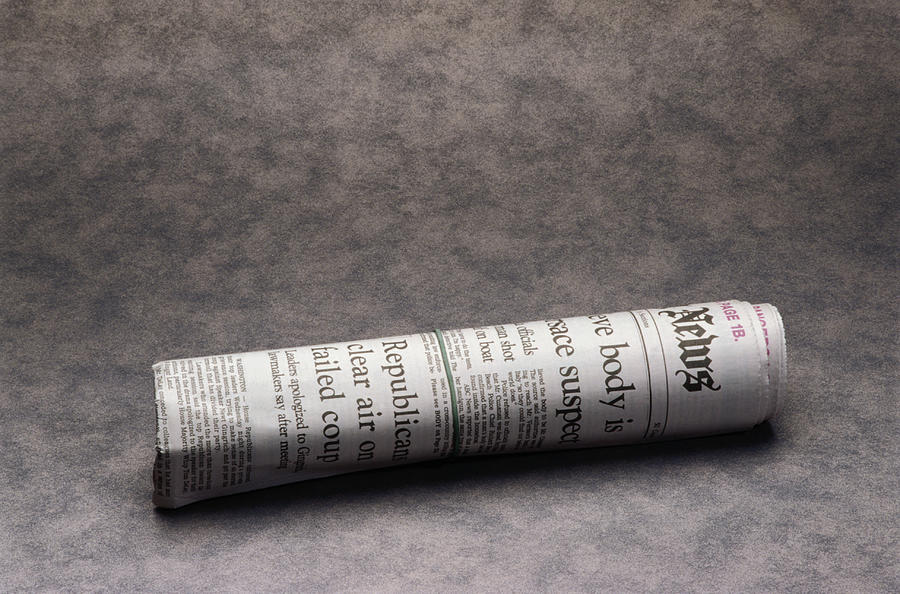 Rolled up newspaper Photograph by David Buffington