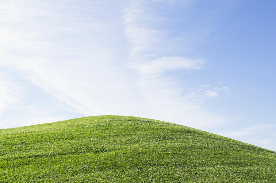 Rolling green hill under blue sky Photograph by Jacobs Stock Photography Ltd