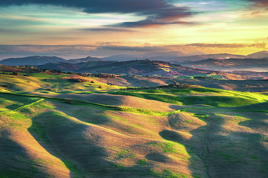 Rolling hills and green fields in Volterra, Tuscany.  Photograph by Stefano Orazzini
