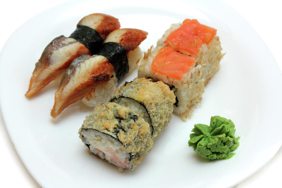 Rolls And Sushi On Plate Photograph by Mikhail Kokhanchikov