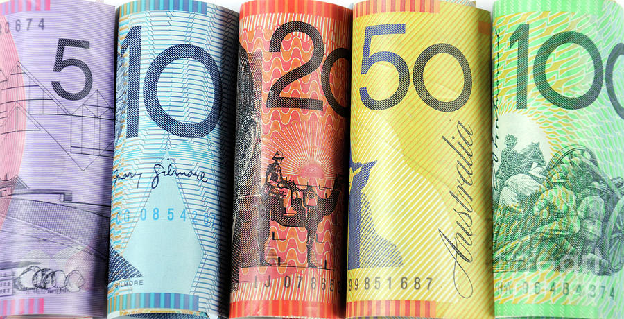Rolls of Australian cash money  Photograph by Milleflore Images