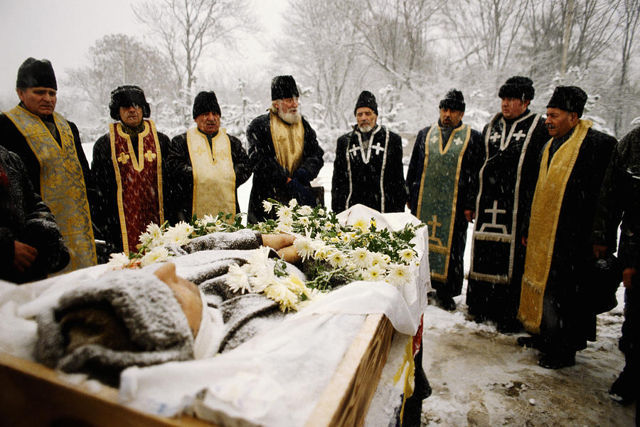 Romania, Bucharest, funeral of fallen heroes of revolution,open coffin Photograph by Christopher Pillitz