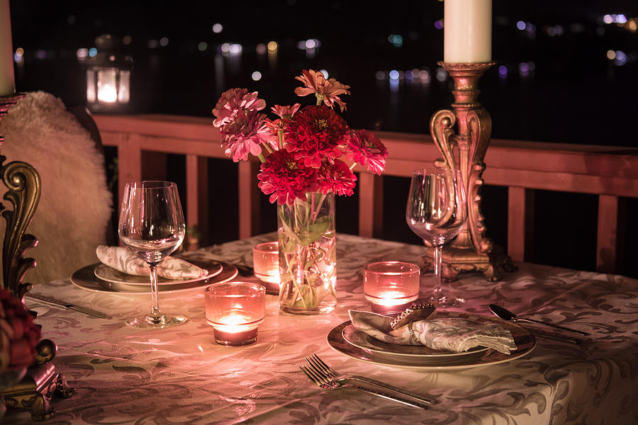 Romantic Dining at Night Photograph by Bjorn Bakstad
