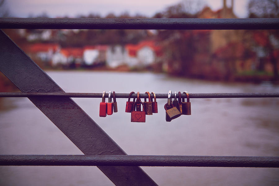 Romantic lover padlocks on a bridge railing Photograph by Mendelex Photography