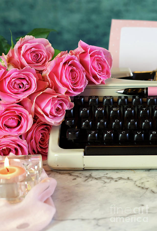 Romantic vintage writing scene, tea break with old typewriter. Photograph by Milleflore Images
