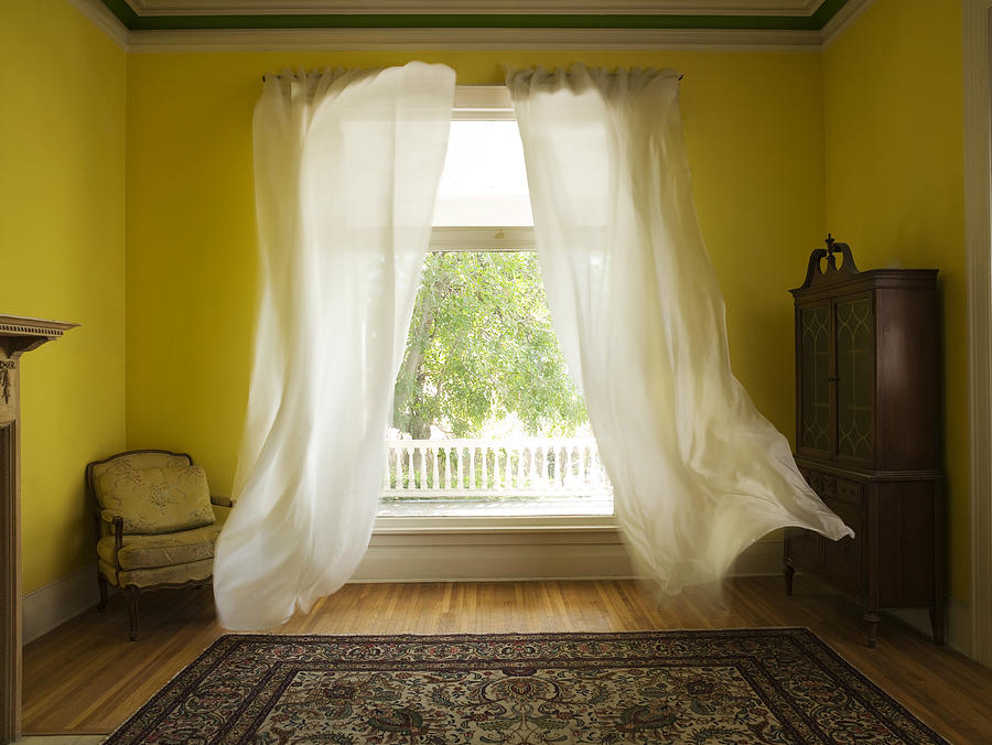 Room with curtains billowing at open window Photograph by Felipe Dupouy