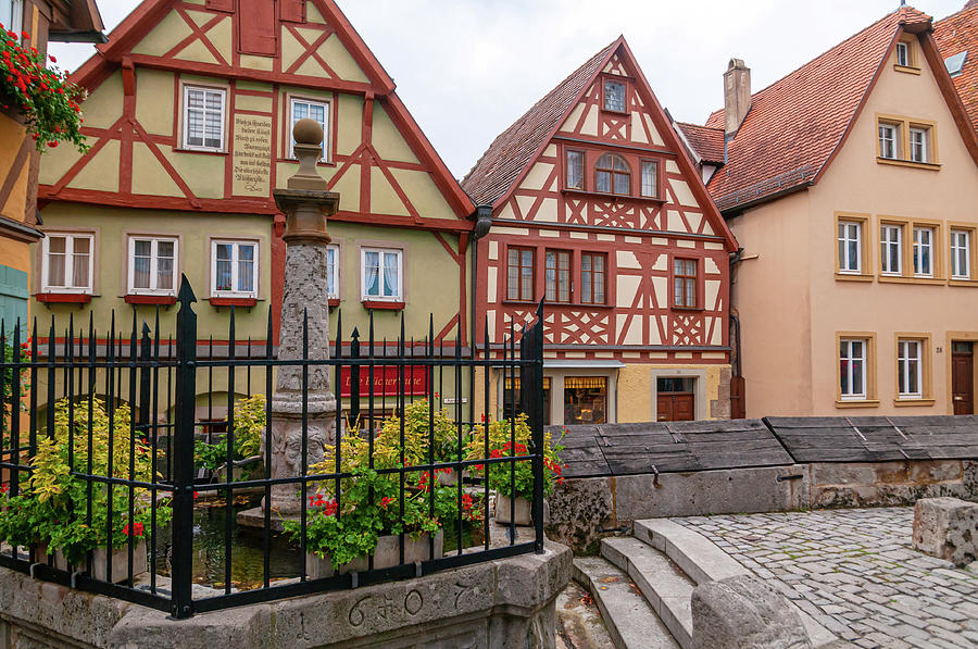 Rothenburg Ob Der Tauber. Little Fountain and Wood Famed Houses On Plonlein Photograph by Jenny Rainbow