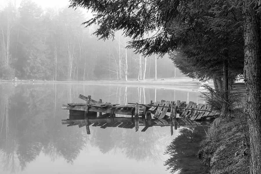 Rotting dock on lake black and white Photograph by Dan Friend