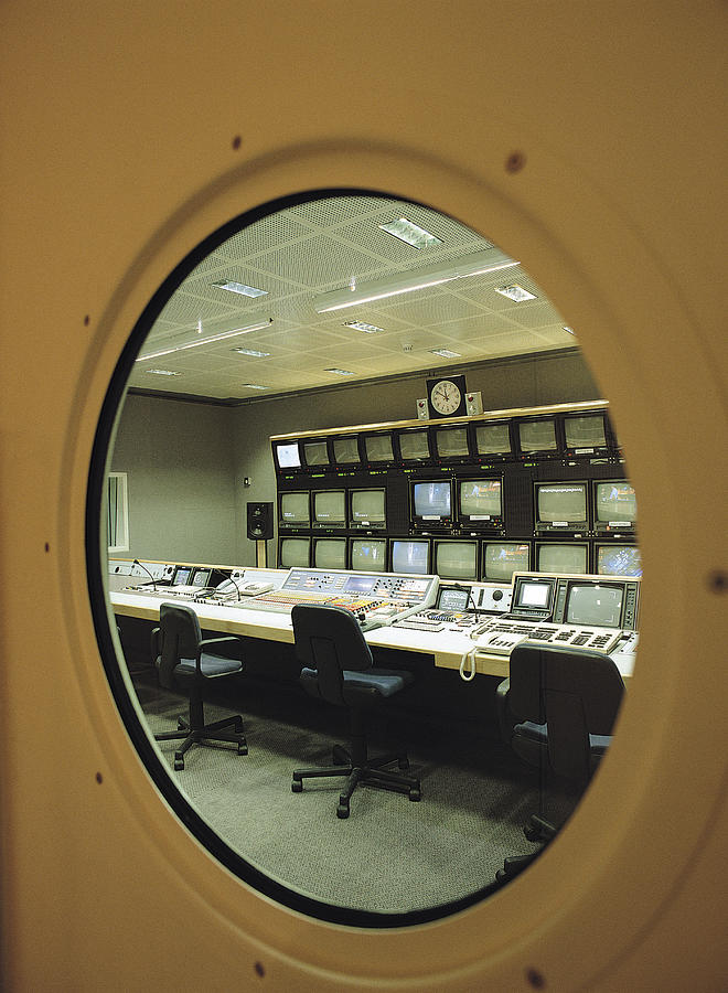 Round window in door of control room Photograph by Tony Weller