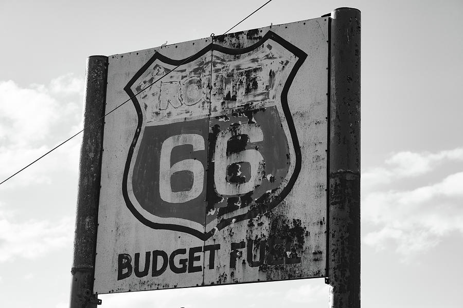 Route 66 Budget Fuel sign in Texas in black and white Photograph by Eldon McGraw