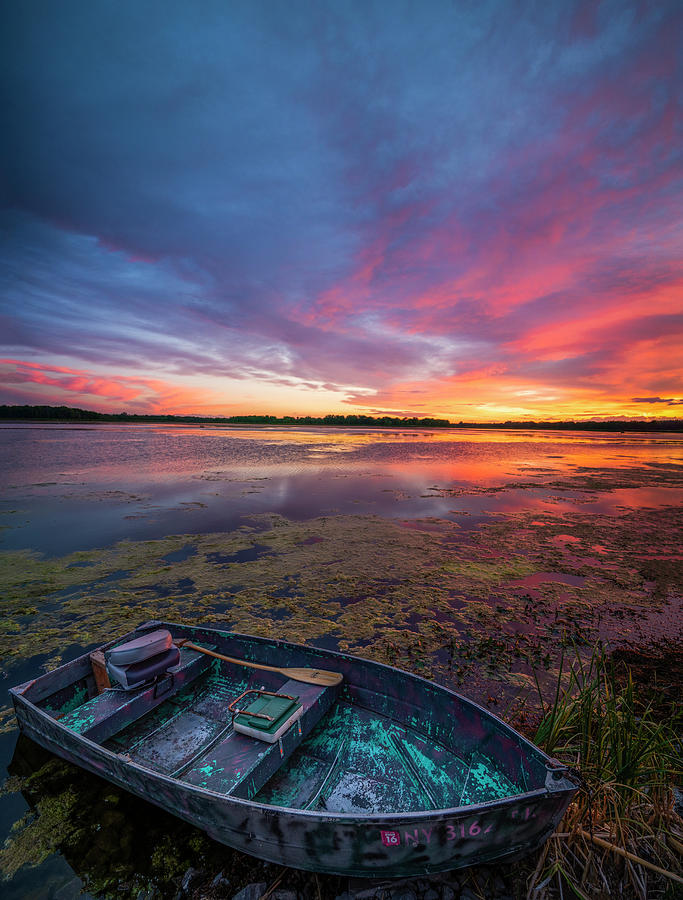 Row boat sunset Photograph by Mark Papke