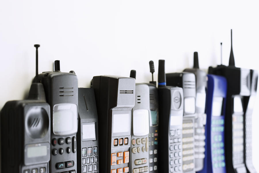 Row of Cell Phones Photograph by Moodboard