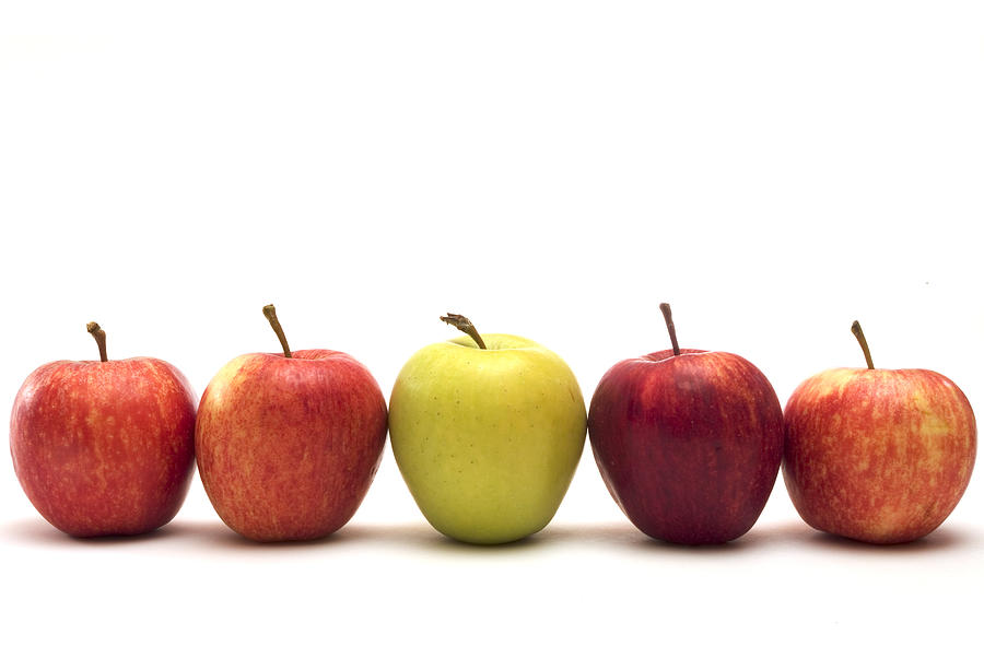 Row of five apples with different colors on a white surface Photograph by Abzee