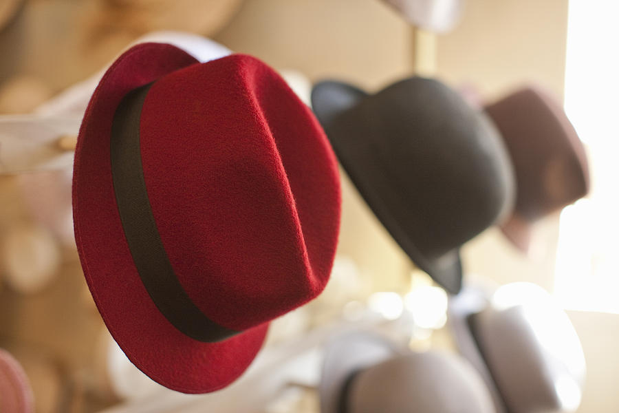 Row of hats in traditional milliners shop Photograph by Zero Creatives