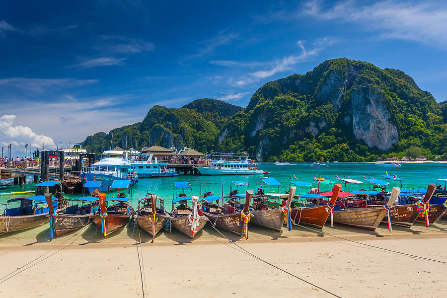 Row of longtail boats at Phi Phi island Photograph by Simonlong