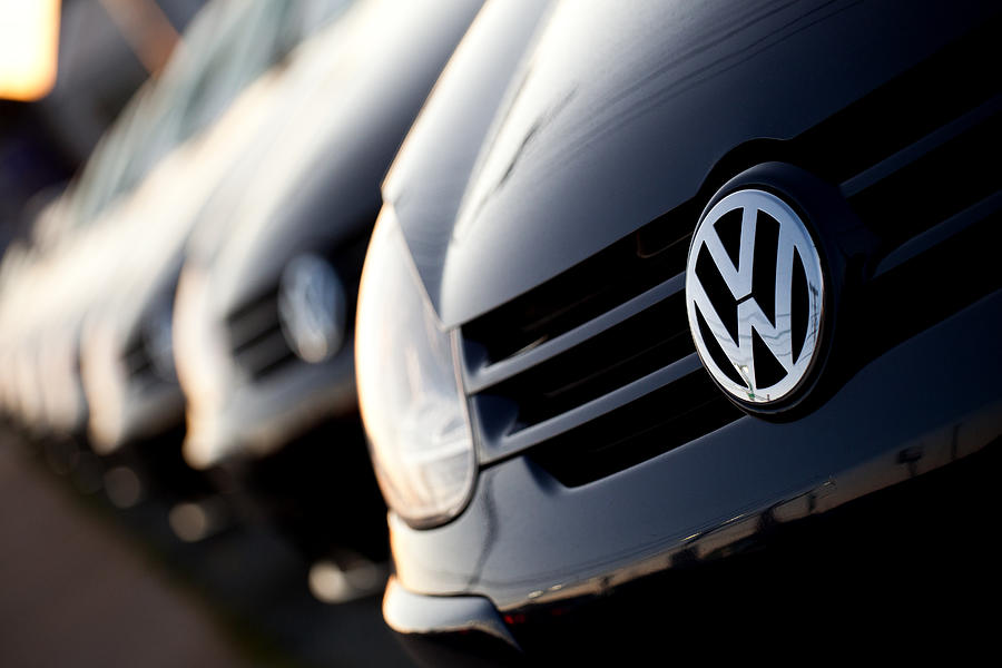 Row of new Volkswagens at dealership Photograph by Garett_mosher