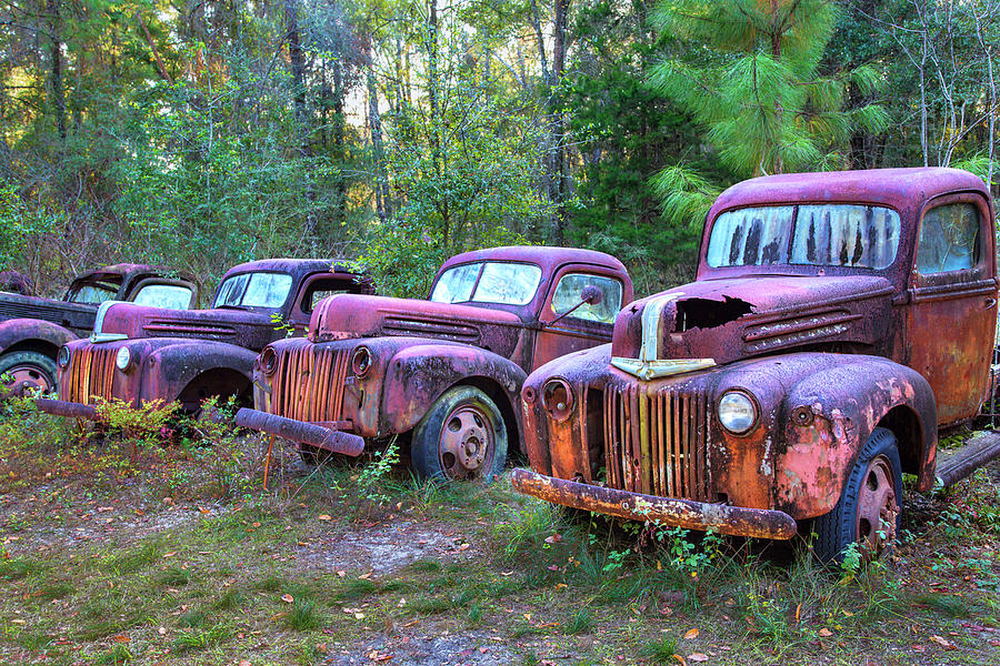 Row of old abandoned trucks #2 Photograph by Jim Schwabel - Fine Art ...