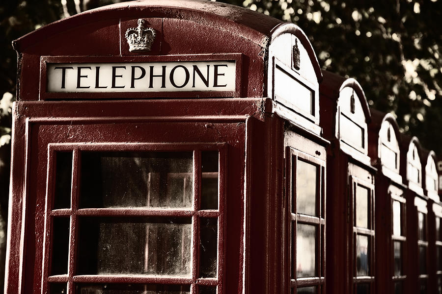Row of telephone boxes, London, UK Photograph by BaMa