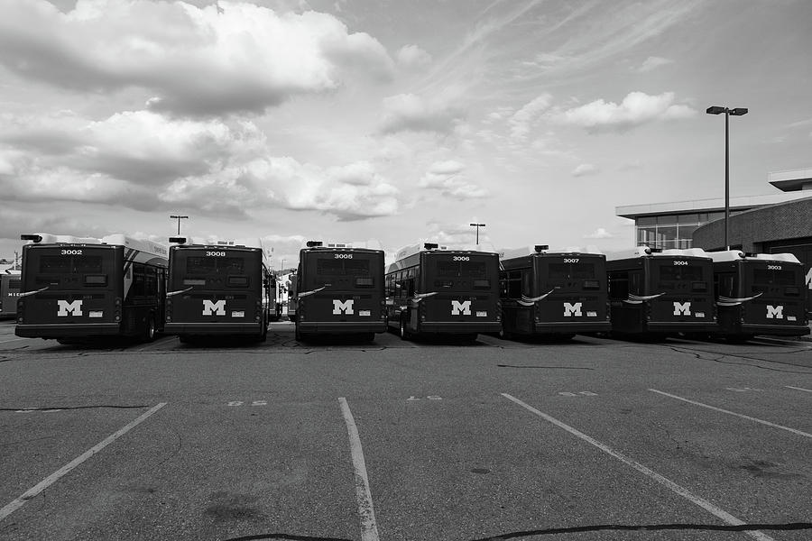 Row of University of Michigan busses in black and white Photograph by Eldon McGraw