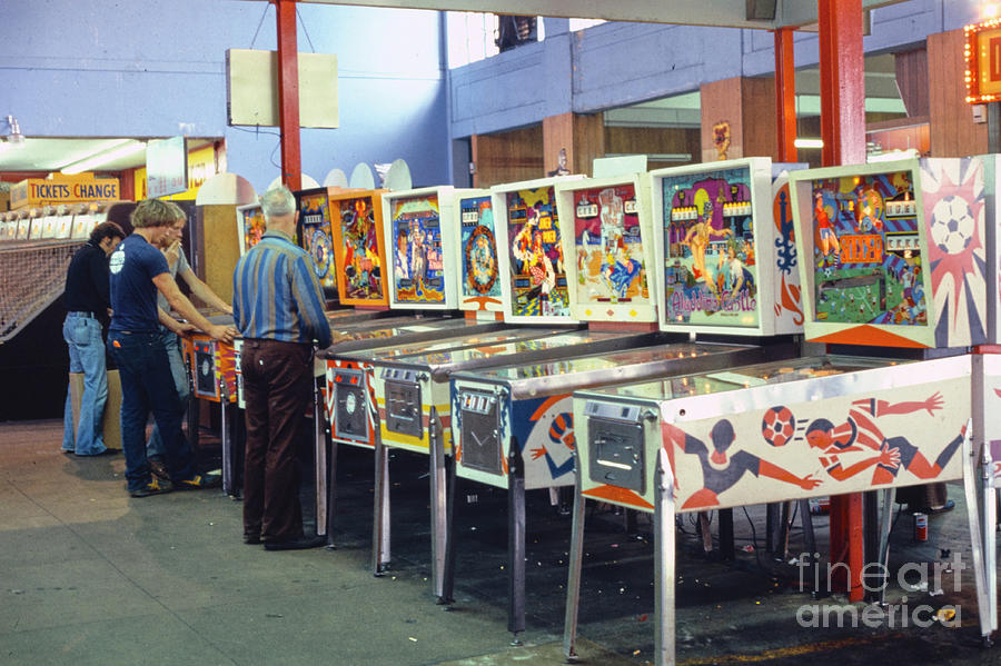 Row of vintage pinball machines Photograph by Edward Fielding