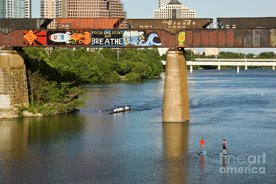 Inspirational Photograph - Rowers and SUP paddle boarders row under the famous Focus One Point And Breathe by Dan Herron