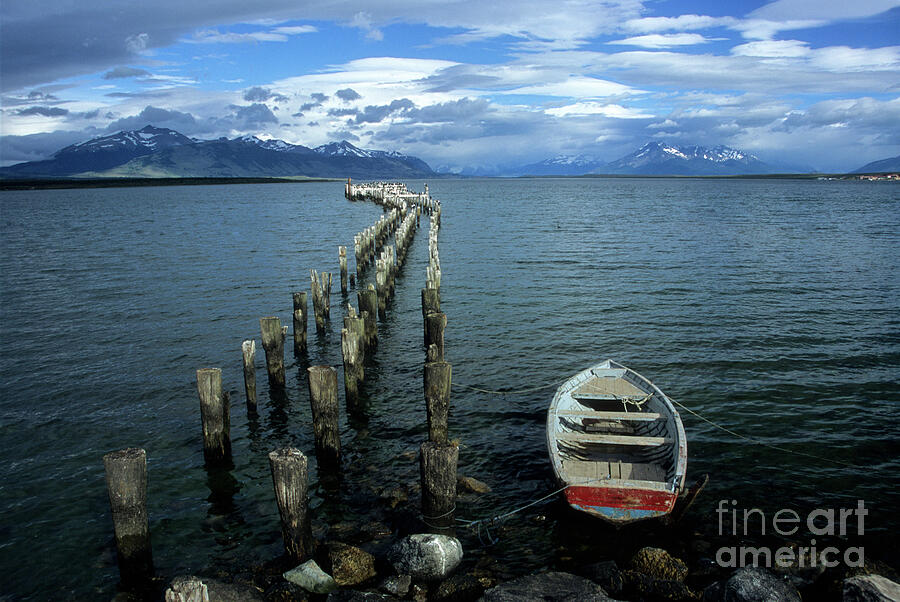 Rowing boat and ruined pier Puerto Natales Chile Photograph by James Brunker