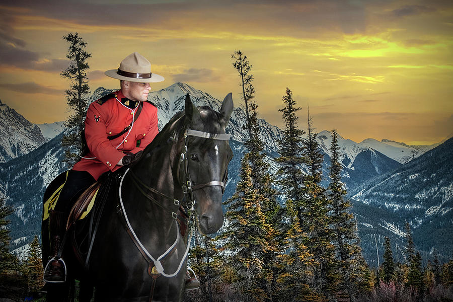 Royal Canadian Mounted Police on horse back in the Mountains Photograph by Randall Nyhof