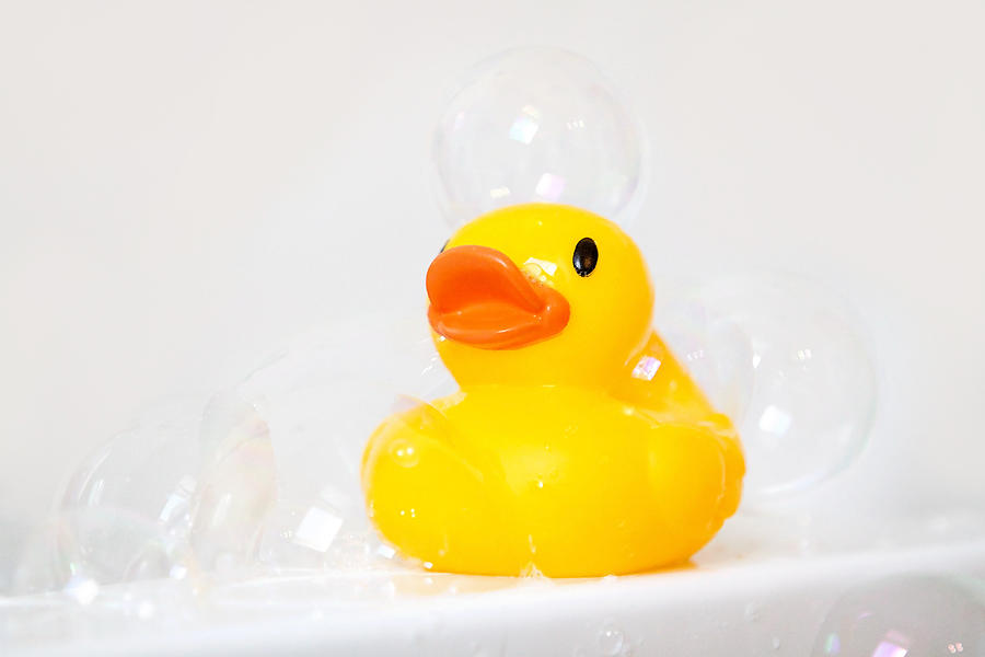 Rubber ducky with bubbles Photograph by Kelly Sillaste