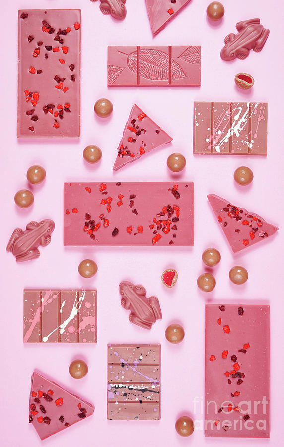 Candy Photograph - Ruby chocolate selection flat lay overhead on pink background. by Milleflore Images