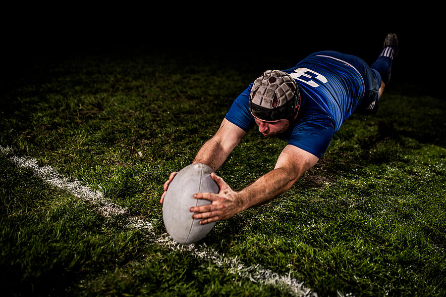 Rugby player scoring a goal Photograph by Simonkr