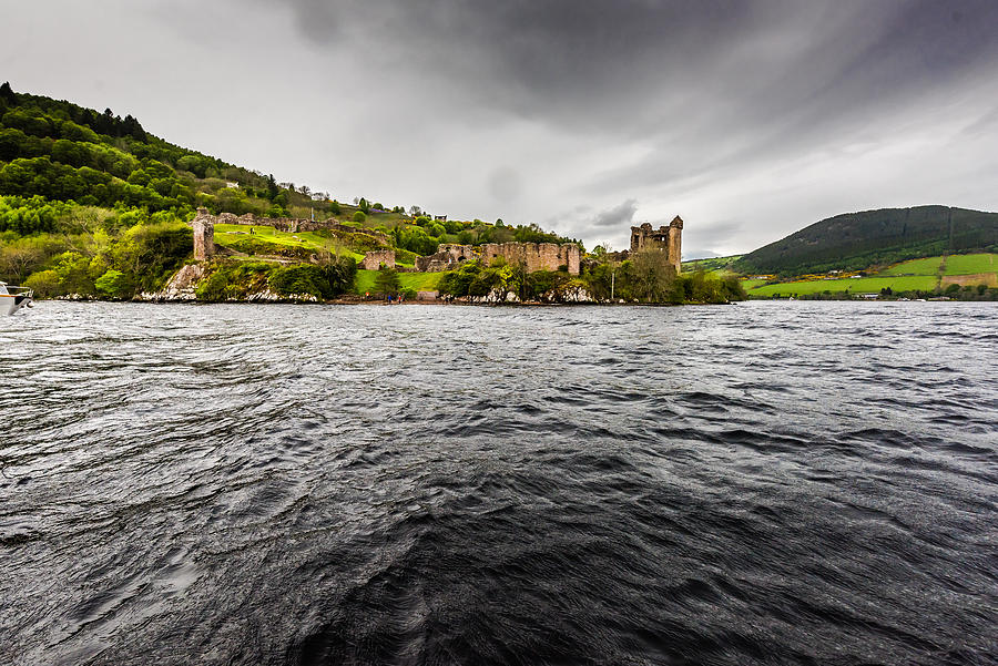 Ruins of Urquhart castle as seen from Loch Ness Photograph by Lensalot