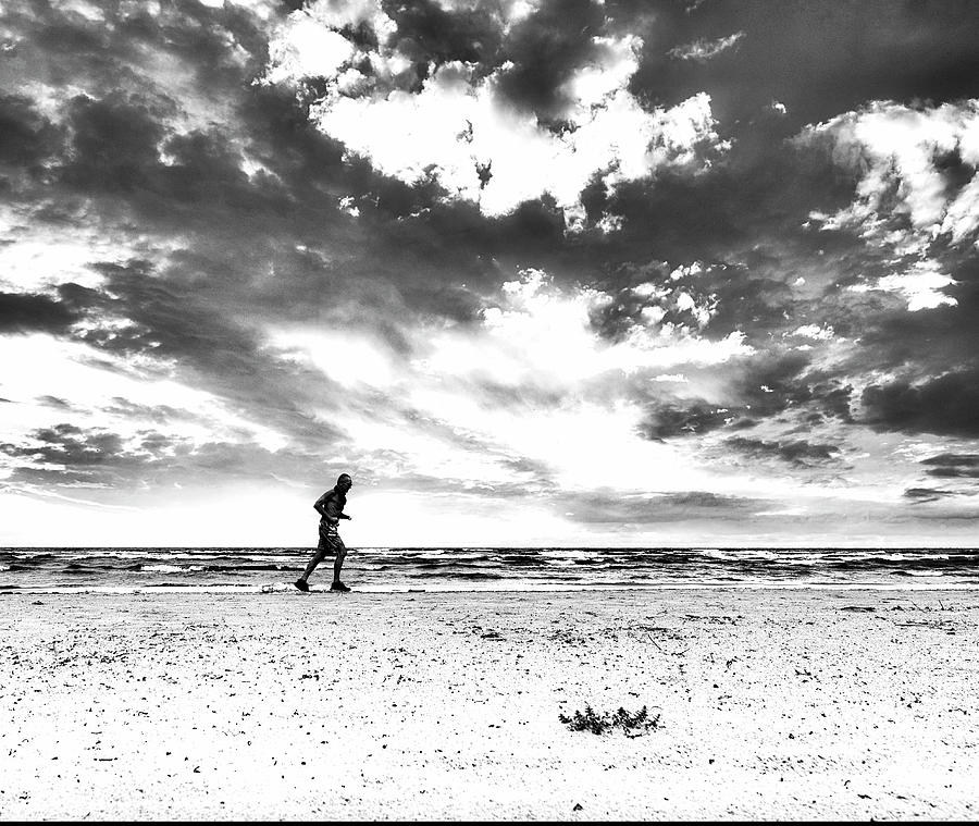 Runner On The Beach Jurmala Photograph by Aleksandrs Drozdovs Runner On The Beach Jurmala Photograph by Aleksandrs Drozdovs