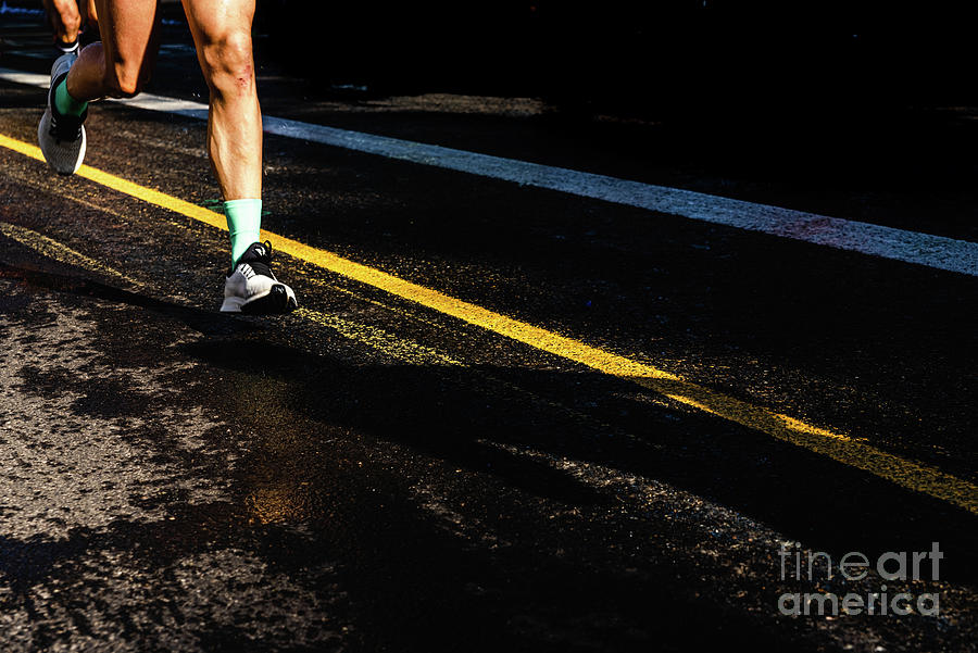 Running athletes have powerful quadriceps and calf muscles for r Photograph by Joaquin Corbalan