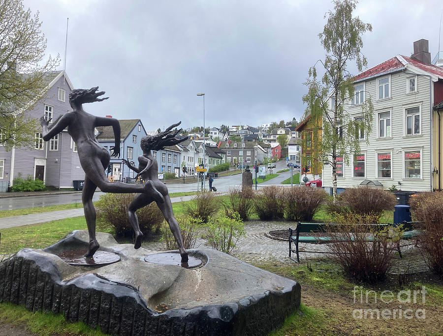 Running ladies sculpture -Tromso, Norway Photograph by Phil Banks