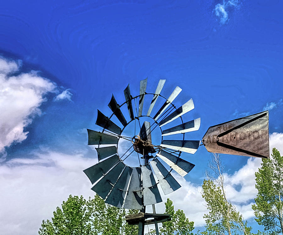Rural America Windmill and blue sky Photograph by Cathy Anderson