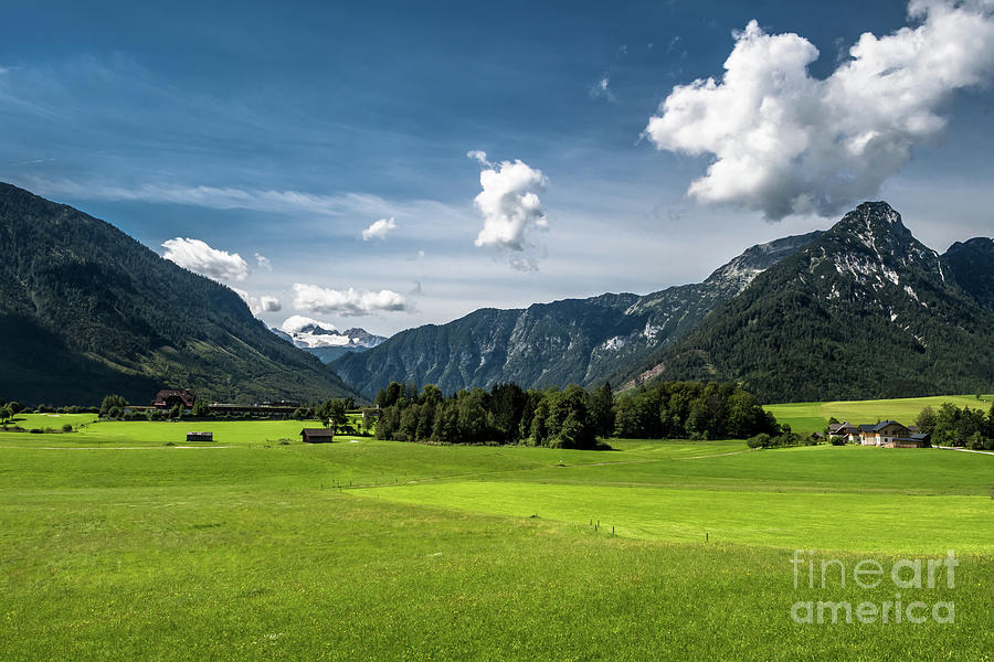 Rural Landscape With Houses In Front Of Mountain Dachstein In The Alps Of Austria Photograph by Andreas Berthold