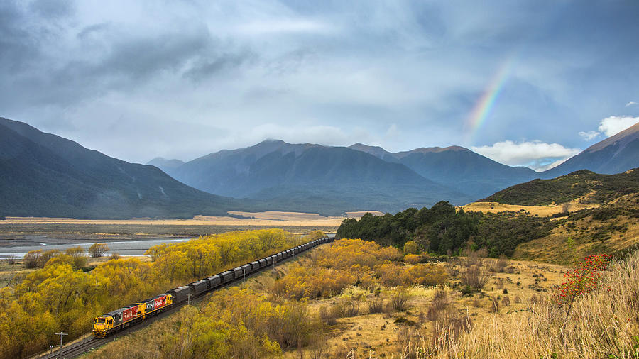 Rural scene with the train and the rainbow Photograph by [Genesis] - Korawee Ratchapakdee