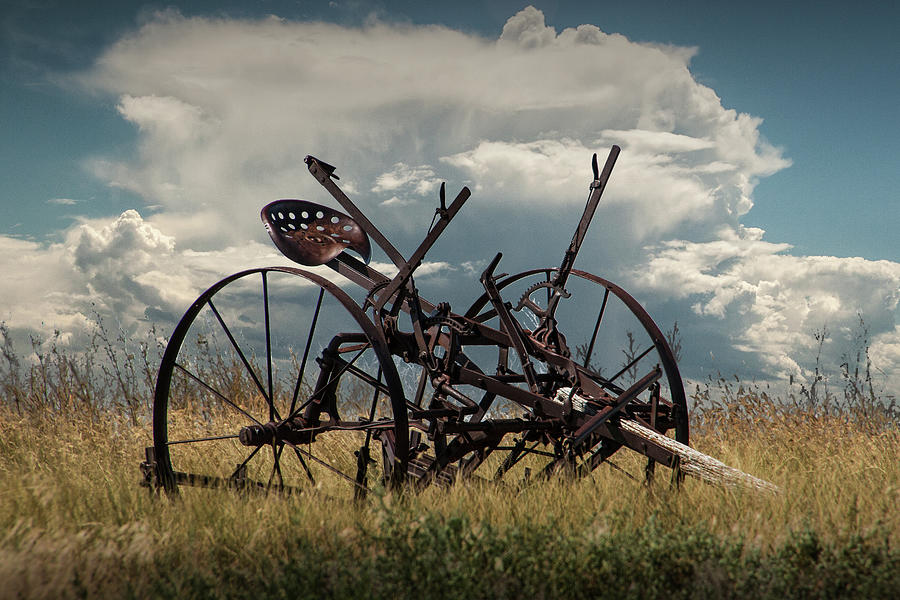 Rusted Farm Equipment In The Grass On The Prairie Photograph