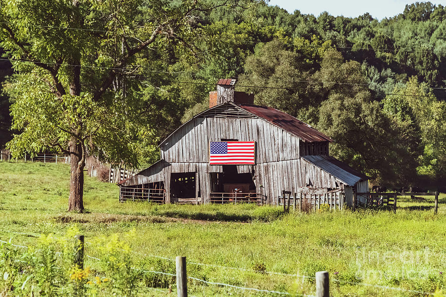 Rustic Barn with American Flag Photograph by Kelly Nowak
