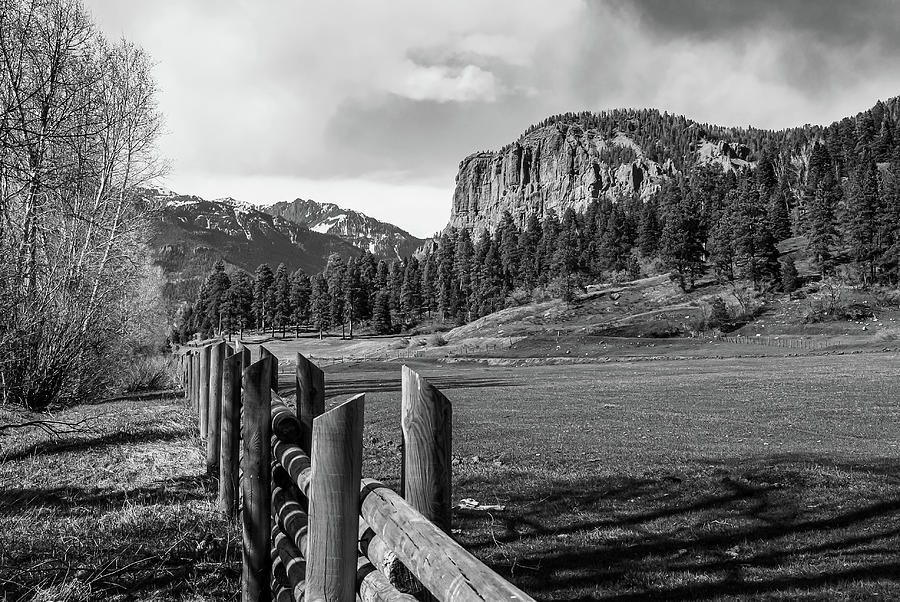 Rustic Colorado Mountains And Wooden Fence Line In Monochrome Photograph