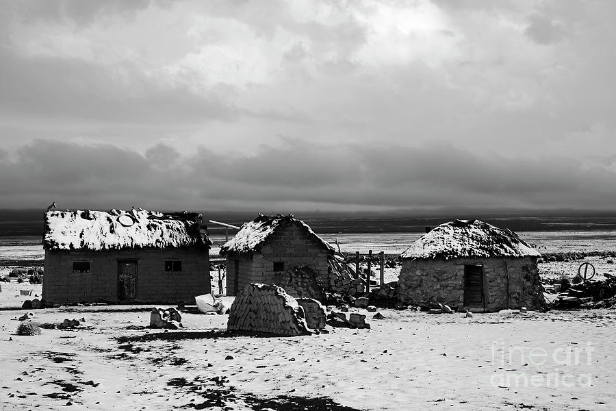Rustic houses in the snow black and white Bolivia Photograph by James Brunker