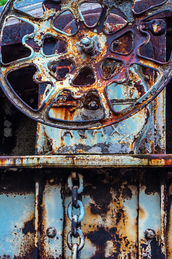 Rusting Wheel Photograph by Stewart Helberg
