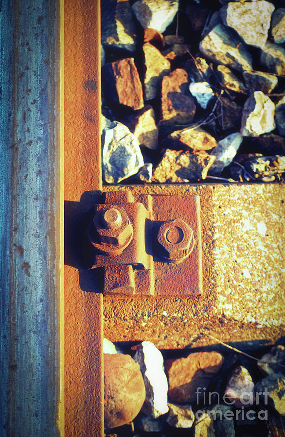 Rusty bolt and screw nut next to a rail steel beam Photograph by Mendelex Photography